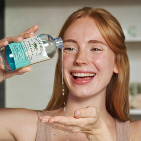 Humphreys 8 fl oz bottle next to ruler indicating size and travel-friendly benefit