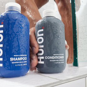 Huron conditioner on bathroom shelf in lifestyle scene promoting fresh scented hair