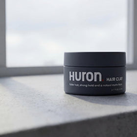 Huron jar on bathroom vanity in lifestyle scene for daily grooming routine benefit