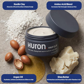 Huron clay swiped on fingers demonstrating smooth spreadability and control benefit