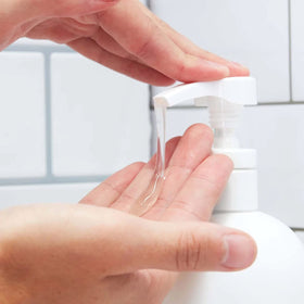 Huron in-shower use lifestyle photo showcasing refreshed, fragrant hair