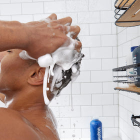 Huron shampoo in shower use showing refreshing citrus scent and cleanse benefit