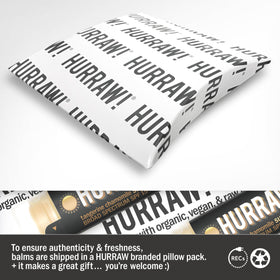 HURRAW! tube held in hand for size, travel-friendly and pocket-ready