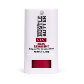 Hustle Butter front packaging showing compact sunscreen stick protecting tattoos