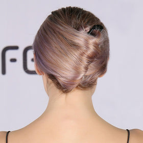 HYFEEL hair pin next to hand for scale showing extra-long size for thick hair