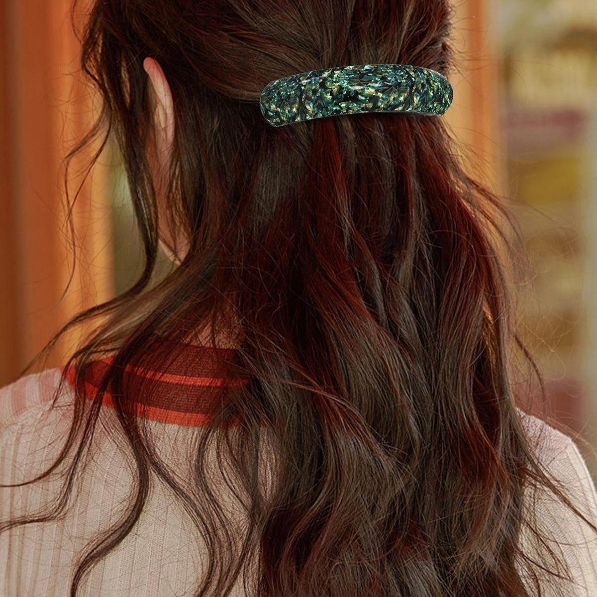 HYFEEL barrette held next to hand to show size and capacity