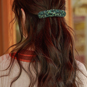 HYFEEL barrette held next to hand to show size and capacity