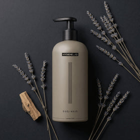 HygieneLab 10 oz bottle next to a hand showing real size and travel-ready convenience