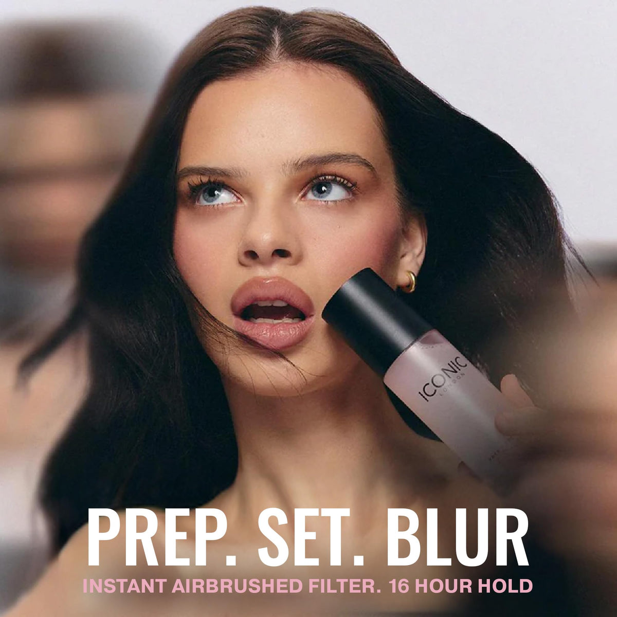ICONIC LONDON model applying mist for refreshed, radiant complexion