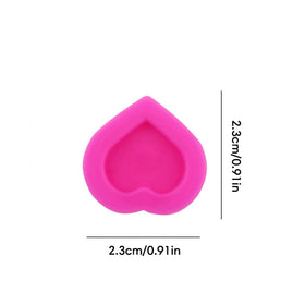 IFERO heart ink cap next to tattoo needle for scale showing compact size benefit