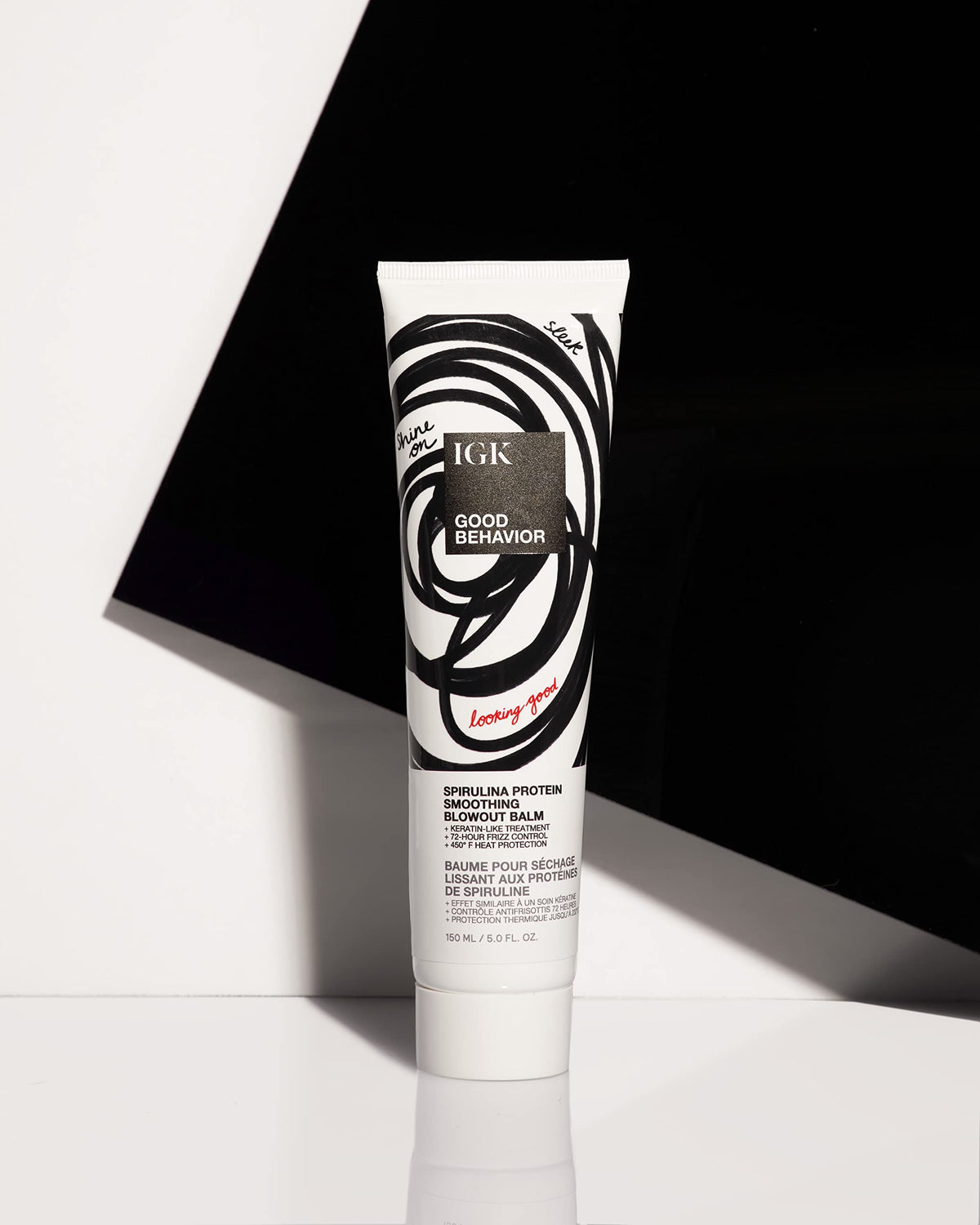 IGK balm applied to damp hair mid-lengths showing easier blow-dry manageability