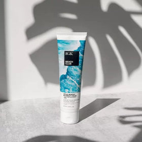 Model using IGK Beach Club during blowout to add bounce and protect from heat