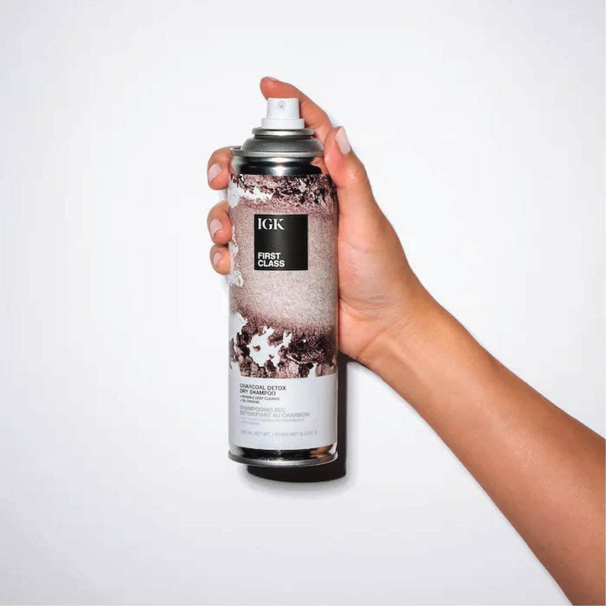IGK bottle label close-up displaying ingredients and clean-beauty benefit