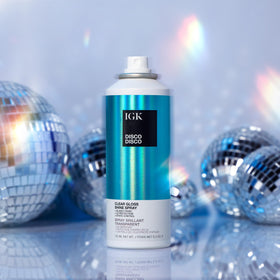IGK Disco Disco in a travel bag lifestyle shot showing portable shine refresh