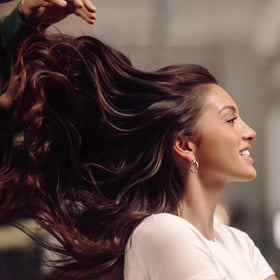 IGK conditioner texture close-up showing smooth slip for detangling