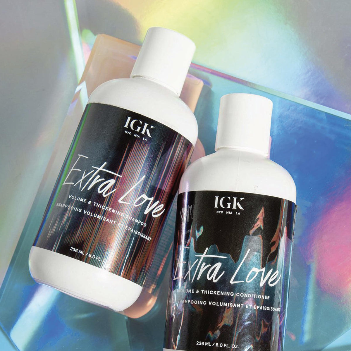 IGK Extra Love next to everyday items for 8 oz size context and portability