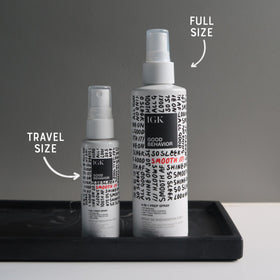 IGK travel bottle next to full size showing convenient kit for travel