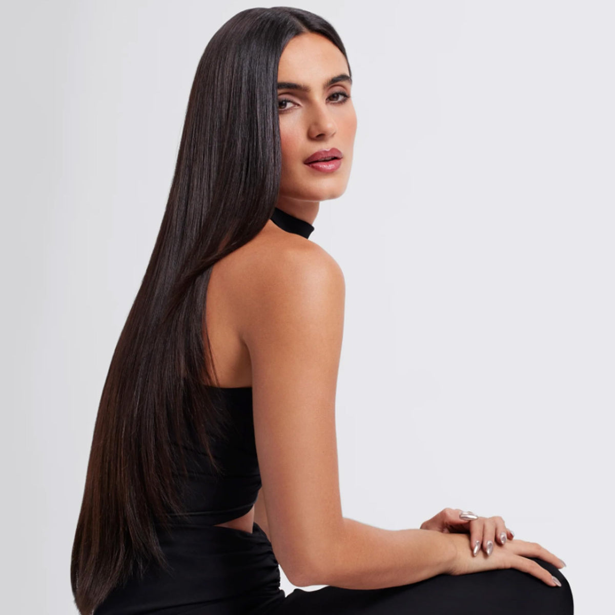 IGK applying shampoo to wet hair for frizz control and gentle cleanse