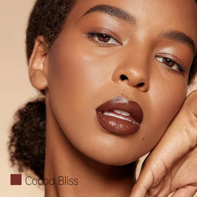 ilembane on model lips demonstrating warm chocolate nude color and smooth finish