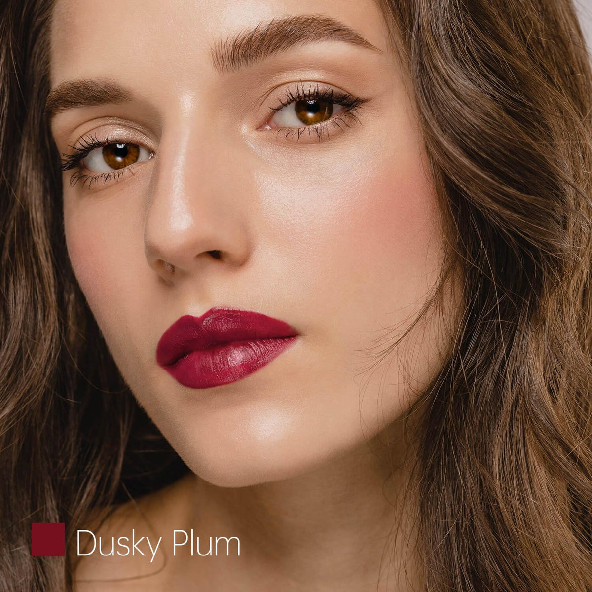 ilembane swatch on arm illustrating true dusky plum pigment and buildable color