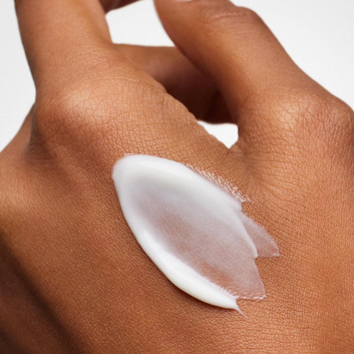 ILIA application on hand showing spreadable cream and comfortable, non-greasy finish