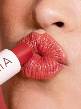 ILIA Balmy Tint inside a purse scene showing ready-to-go moisturizing color