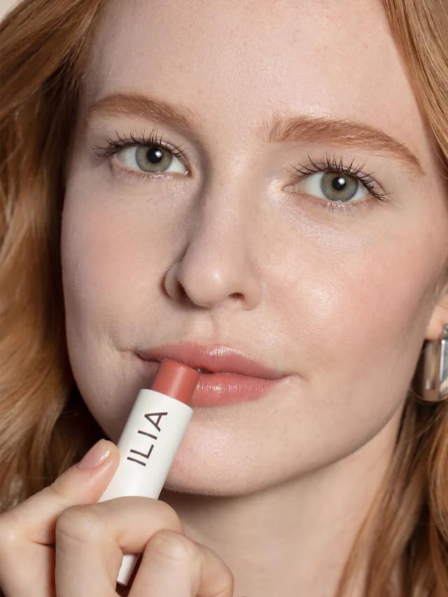 ILIA lip application close-up with visible moisturized sheen and soft color payoff