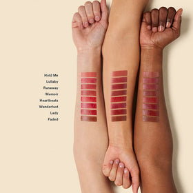 ILIA model wearing Heartbeats balm demonstrating natural warm-red color boost