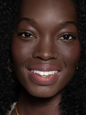 ILIA shea butter ingredient close-up with balm tube showing nourishing texture benefit