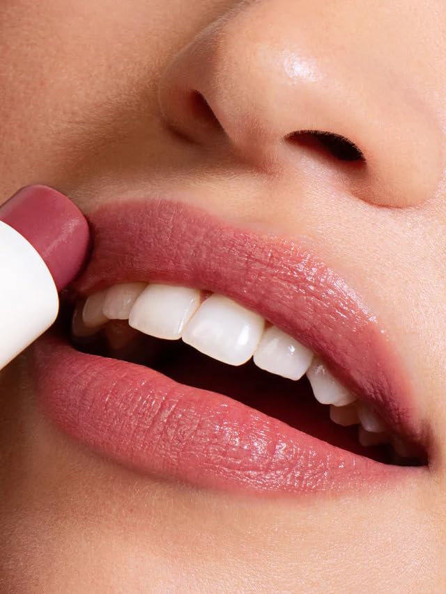 ILIA Lullaby shade flatlay showing cool rose-pink and soft shine