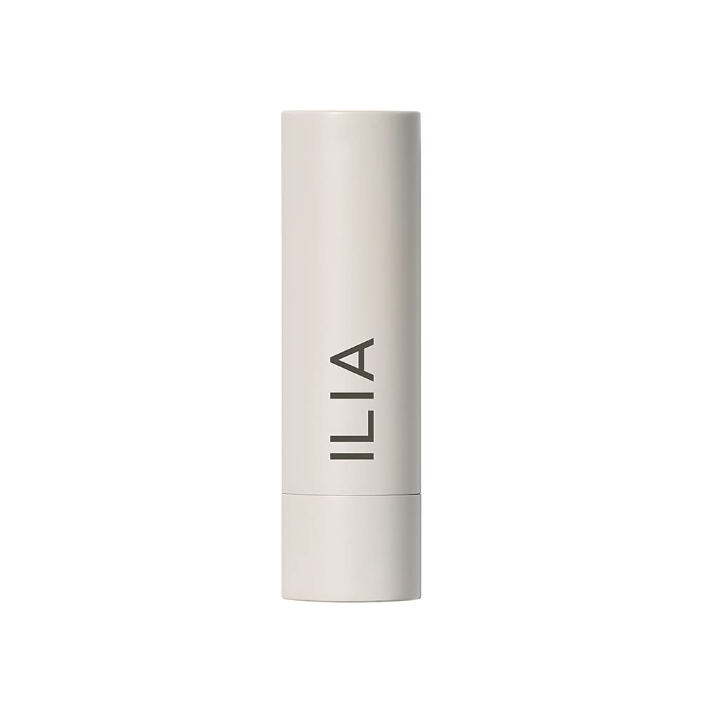 ILIA swiped on lips showing neutral cranberry tint and natural soft shine