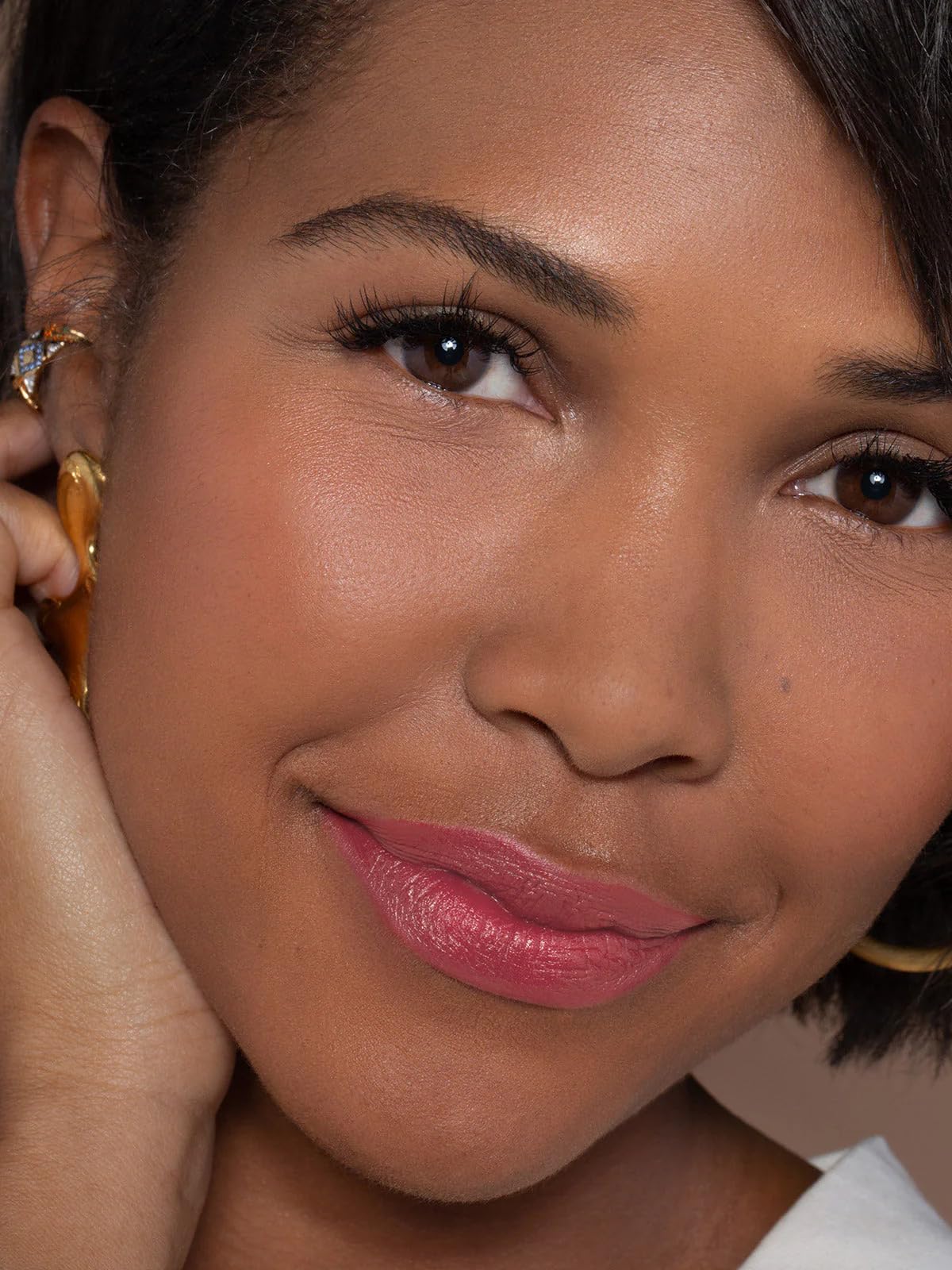 ILIA lipstick worn on model lips showing Rosette flattering cool-pink effect