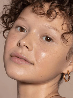 ILIA before-and-after comparison showing subtle coverage and smoother skin appearance benefit