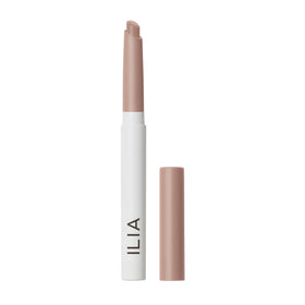 ILIA eye stylus front view showing sleek stick and taupe color for easy application