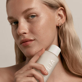 ILIA product on fingertip spreading quickly to hydrate skin