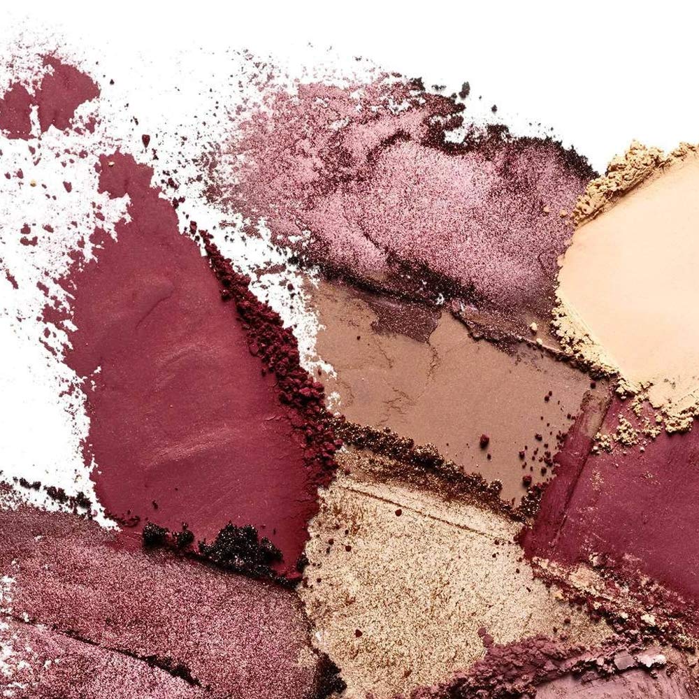 ILIA lifestyle flatlay on a makeup table illustrating everyday wearable colors