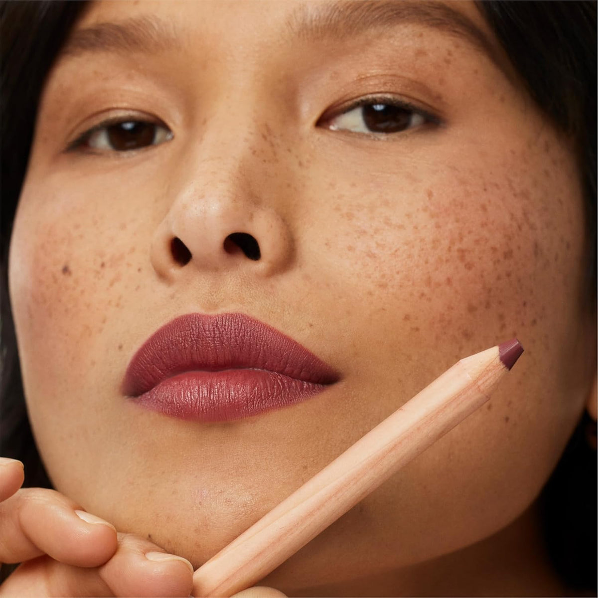 ILIA Gala lip on model showing natural brick-rose color and comfortable soft-matte benefit