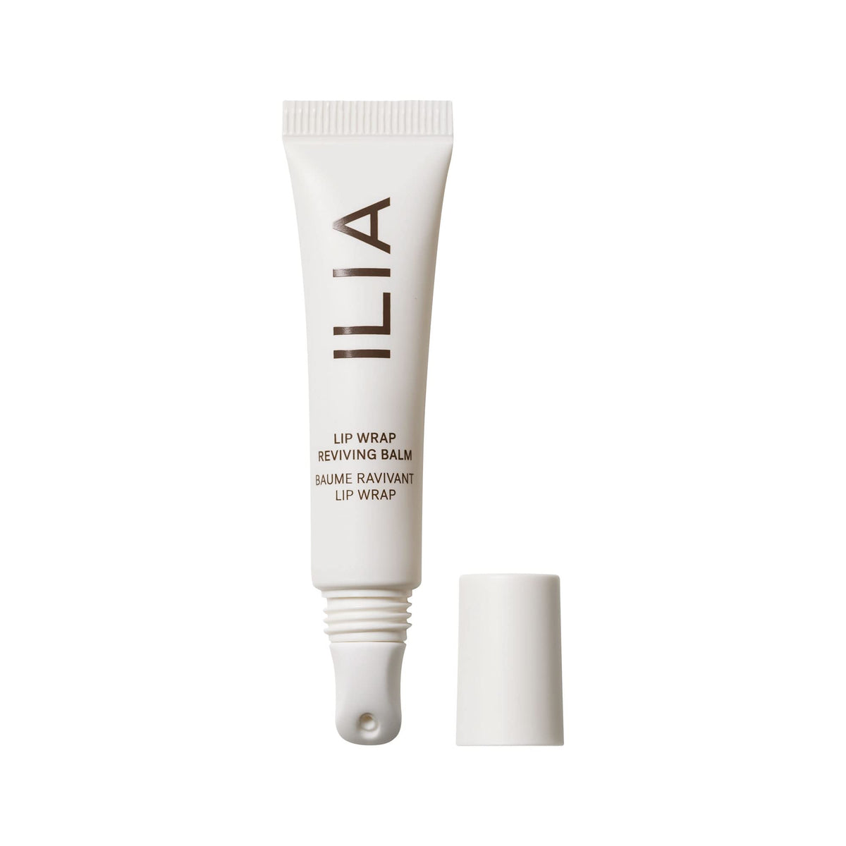 ILIA front packaging of Lip Wrap balm showing sleek tube and branding, travel-ready