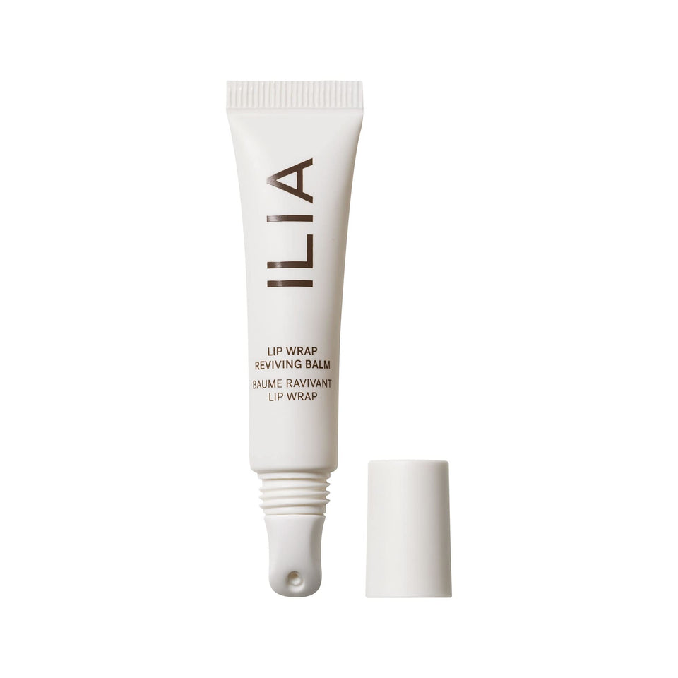 ILIA front packaging of Lip Wrap balm showing sleek tube and branding, travel-ready