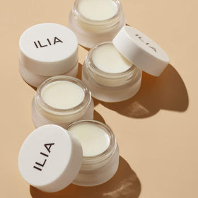 ILIA jar on bathroom counter at night implying restful repair while sleeping