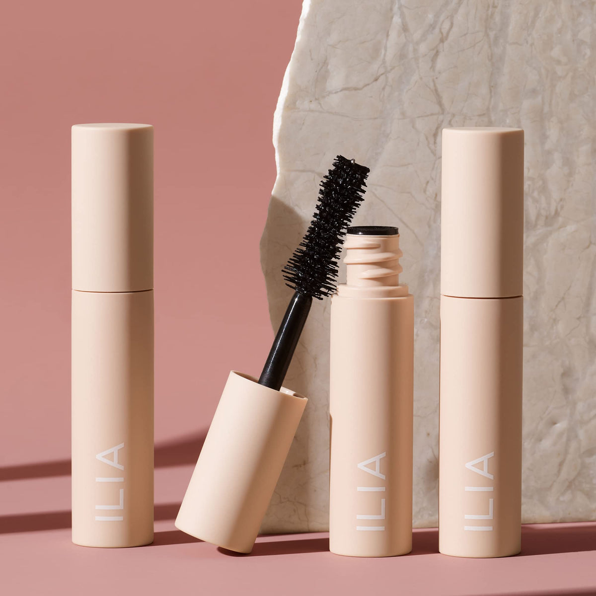 ILIA mascara on model lashes showing before and after for visible volume and definition