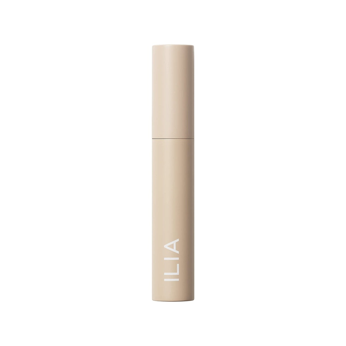 ILIA mascara packaging flat-lay with supporting clean-beauty props