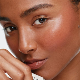 ILIA Multi‑Stick cheek application closeup showing natural flush benefit