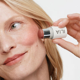 ILIA Multi‑Stick lip application closeup showing coordinated tint benefit