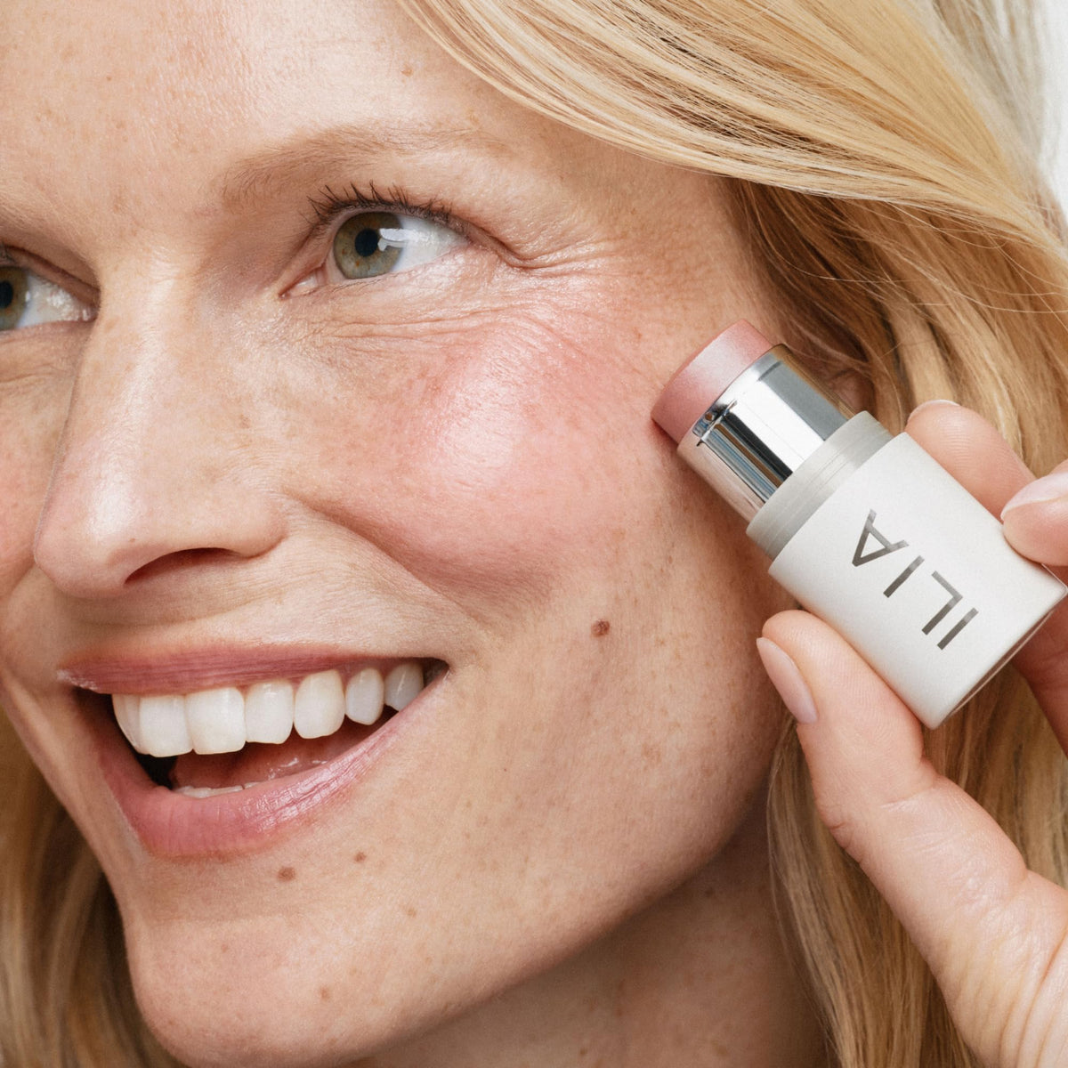 ILIA product applied to cheeks demonstrating luminous glow and natural finish