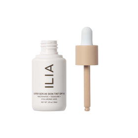 ILIA pump dispenser close-up demonstrating controlled product dispensing