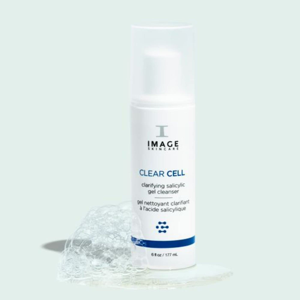 IMAGE Skincare bottle next to hand to show 6 fl oz size and scale