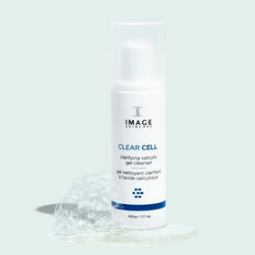 IMAGE Skincare bottle next to hand to show 6 fl oz size and scale