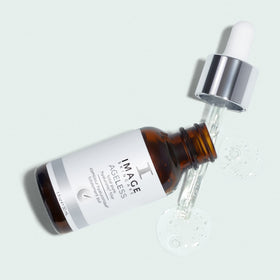 IMAGE Skincare bottle staged with morning skincare products for routine layering