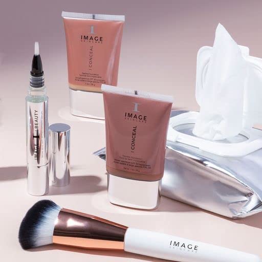 IMAGE Skincare pack held in hand to show scale and travel-friendly compact size